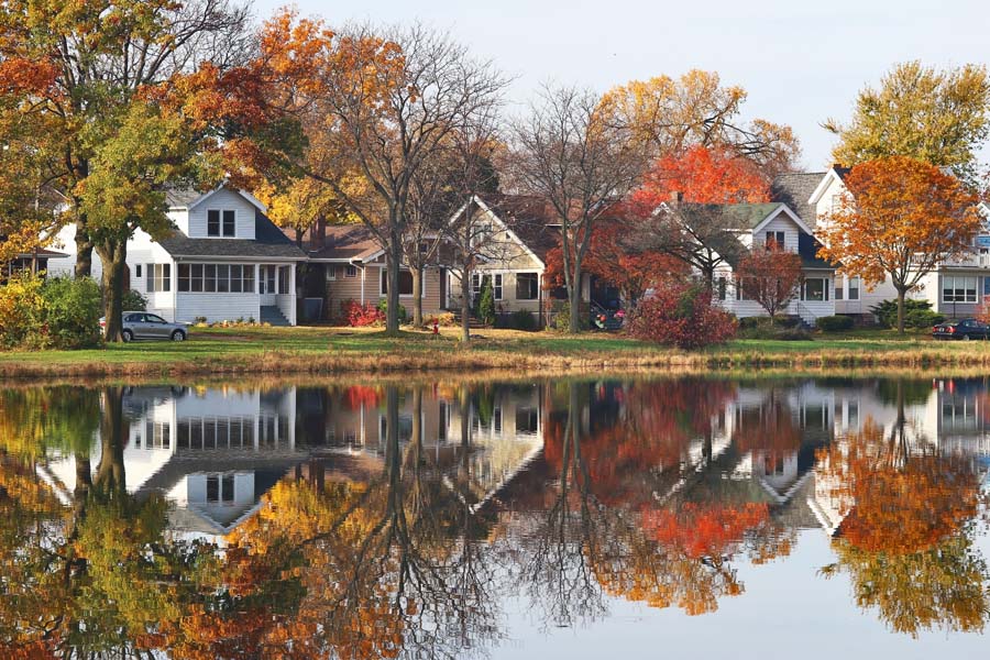 Contact Us - WI Fall Overlooking the Water with Homes in the Background