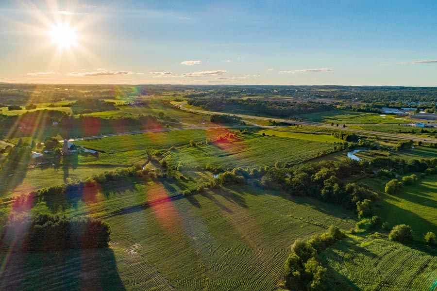 Germantown, WI Insurance - Rising Sun Over WI Farmland in Summertime